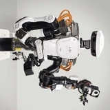 a humanoid alongside workers